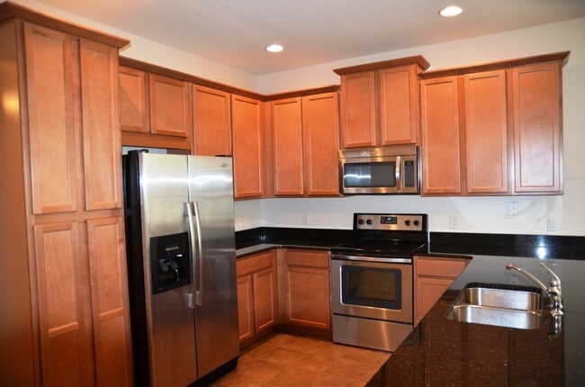 Building Photo - Nice 3/2 with Tile Flooring and 2-Car Garage in Azalea Cove (SE Orlando)
