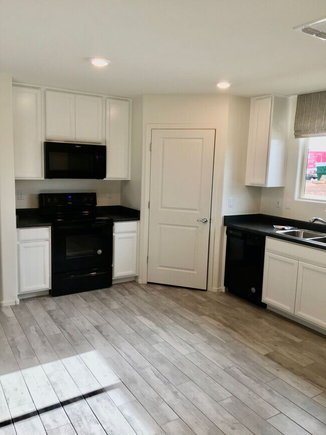 Building Photo - COMING SOON! New 3BR 2 BA Home w/ 2-Car Garage • Stainless Kitchen • Timer-Irrigated Yard in East...