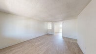 Located at 3255 Gateway St in Springfield, Oregon, this single-story, one-bedroom, one-bathroom unit offers a clean, modern interior with a bright and neutral aesthetic throughout. Light wood-style flooring runs continuously across all rooms, complemented by crisp white walls and textured ceilings that add subtle character to each space.

The living room is generously proportioned, featuring multiple windows that invite natural light and views of the surrounding area. A dedicated entry door opens directly into the living space, enhancing functionality. The layout flows naturally into the kitchen, which is equipped with white shaker-style cabinetry, light marble-look countertops, a stainless steel refrigerator, range, and dishwasher, along with a single-basin sink — a practical and attractive setup for everyday use.

The bedroom is a comfortable size and includes a sliding-door closet with a built-in hanging rod, while the unit benefits from a total of four closets, providing exceptional storage throughout. The bathroom features a long vanity with white cabinetry, a marble-look countertop, a framed mirror, modern black fixtures, and a full-size soaking tub, all brightened by a frosted window. The overall ambiance is clean, light, and move-in ready.