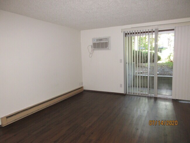 living room, slider, wall AC - 6320 N Calispel St