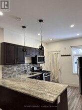 Building Photo - 1152 King St E