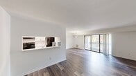 This 800 square foot apartment, located at 200 Foxhall Drive in Bel Air, MD, offers a contemporary living experience with its recently renovated interiors. The single-story layout comprises two bedrooms, including a spacious 180 square foot primary bedroom, and two full bathrooms. Throughout the apartment, newly installed wood-look flooring adds warmth and durability to the space.

The open-concept living area is bright and airy, benefiting from large sliding glass doors that lead to a private balcony, perfect for enjoying outdoor views. The kitchen features sleek white cabinetry, modern appliances, and ample counter space for meal preparation.

Both bedrooms are well-proportioned, with the master bedroom offering generous closet space behind louvered doors. The bathrooms are tastefully updated, with one featuring a full-size bathtub and shower combination. Large windows in the bedrooms provide natural light and views of the surrounding area.

The apartment's neutral color palette, with crisp white walls and ceilings, creates a blank canvas for personal decoration. Built-in closets throughout offer practical storage solutions. This modern, efficient living space combines comfort and style in a prime Bel Air location.