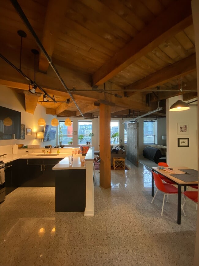 Kitchen area to left, dining area to right with patio - 1408 12th Ave