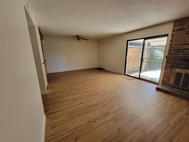 living room and private patio access - 1550 Newborough Dr
