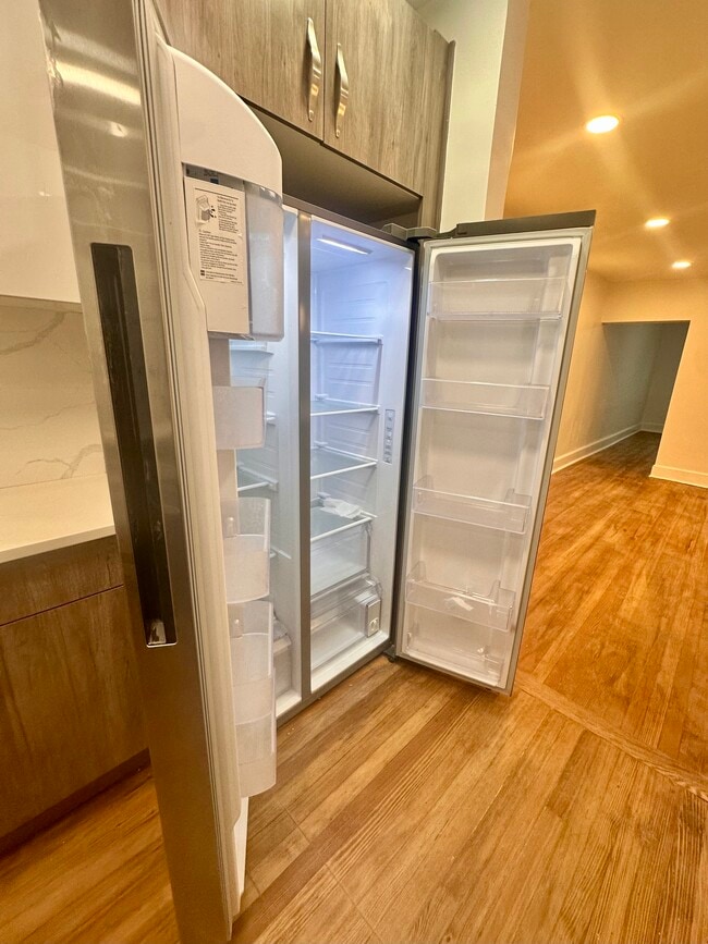 Large-capacity Samsung side-by-side refrigerator/freezer. - 328 High St