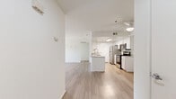 Located at 3362 Honeybrook Way in Ontario, CA, this single-story residence offers a thoughtfully designed 2-bedroom, 2-bathroom floor plan with a clean, modern aesthetic. Light wood-style flooring runs consistently throughout, creating a bright and cohesive feel across every room.

The open-concept living area seamlessly connects the dining room, kitchen, and living room into one expansive, airy space. The kitchen is a standout feature, equipped with stainless steel appliances including a refrigerator, gas range, and microwave, complemented by crisp white cabinetry, quartz-style countertops, and a central island with a sink — ideal for both cooking and casual dining. A ceiling fan overhead adds comfort to the living area.

Both bedrooms are comfortably sized with light-toned walls and wood-style flooring, offering a calm and neutral atmosphere. The primary bedroom includes a walk-in closet with built-in shelving and hanging rods. Each bathroom is finished with white cabinetry, quartz-style counters, and a shower-tub combination.

Additional highlights include a dedicated laundry room with a full-size washer and dryer, a pantry, a hallway, and access to a private patio. The unit's clean, minimalist design and functional layout make it a practical and inviting space.