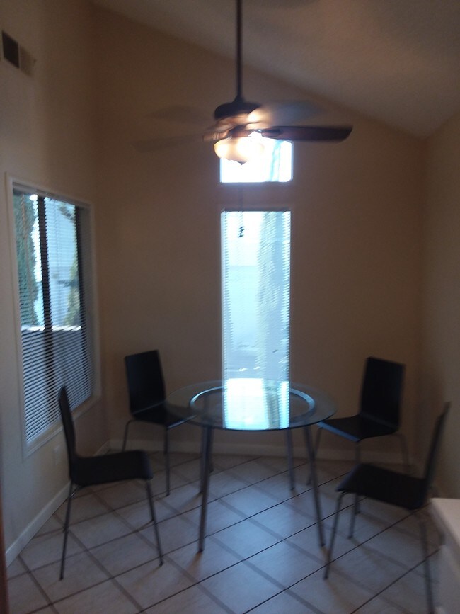 Dining area with ceiling fan - 2135 E Valley Pkwy