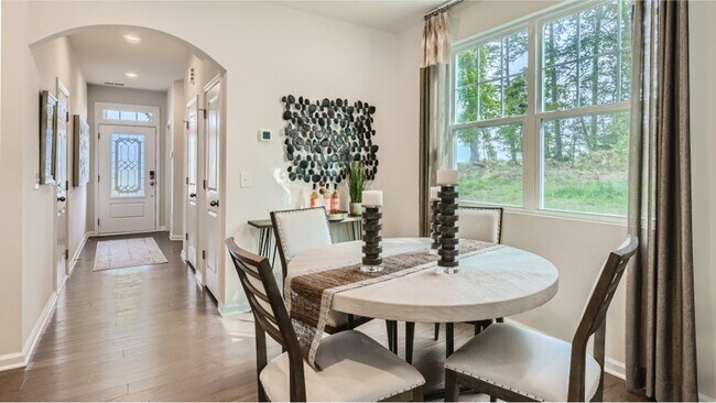 Refined dining space: Elegant furnishings, soft lighting, perfect for gatherings. - 13119 Cottage Crest Ln