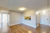This single-floor, 3-bedroom, 2-bathroom residence in Westborough, MA offers a well-organized layout designed for comfortable everyday living. The combined living and dining area is generously sized, featuring rich hardwood-style flooring, neutral-toned walls, and large windows with vertical blinds that invite natural light and provide outdoor views. A pass-through window connects the living area to the kitchen, enhancing the open feel between spaces.

The kitchen is efficiently designed with white cabinetry, gray countertops, hardwood-style flooring, and stainless steel appliances including a gas range, dishwasher, and full-size refrigerator. A hallway connects the main living spaces to the private areas of the home.

All three bedrooms are carpeted and feature neutral tones, with ample natural light from large windows. The primary bedroom offers generous proportions and includes a full closet. Additional closet space is distributed throughout, with four closets total across the unit.

The two bathrooms are clean and functional. One features mosaic tile flooring in warm earth tones, a wide vanity with white cabinetry, a large mirror, and a walk-in shower area. The layout flows intuitively, making this a practical and comfortable home in a convenient Massachusetts location.