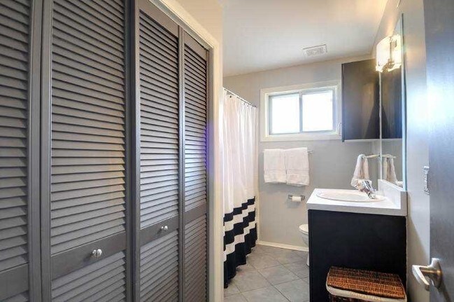 Full bathroom with washer and dryer - 3046 Briarcliff Rd NE