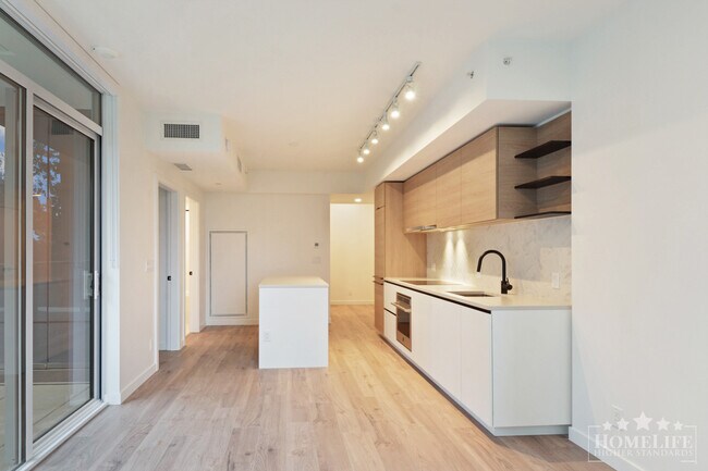 Building Photo - Beautiful 1 Bed + Flex Condo in University District – Surrey City Centre