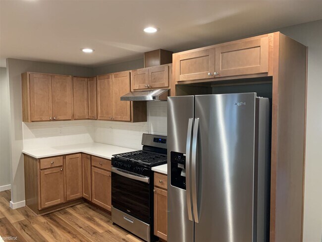 Building Photo - 6 br, 3 bath House - 2410 E 61st Ave 2 fam...