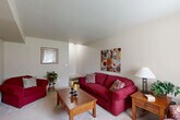 Located in Brownstown, Michigan, this two-story home offers a practical and comfortable layout across two well-proportioned floors. The main level features a bright, carpeted living room with a front-facing window, neutral-toned walls, and a welcoming entryway with closet storage. Adjacent to the living room, the dining area is finished with tile flooring, a ceiling fan with light fixture, and a window overlooking the outdoors, creating a pleasant space for everyday meals. The galley-style kitchen is efficiently designed with warm wood cabinetry lining both sides, a gas range, ample counter space, and tile flooring throughout. The upper level houses all three bedrooms, each with carpet flooring and generous closet space. The primary bedroom offers a comfortable footprint, while the additional bedrooms provide versatility for family or guest use, each with access to natural light via windows with outdoor views. A full bathroom on the upper level features a tub-shower combination. With six closets distributed throughout, a utility room, and two staircases, the home is thoughtfully organized to maximize storage and functionality. The neutral color palette and carpet-and-tile combination create a cohesive, move-in-ready feel throughout.