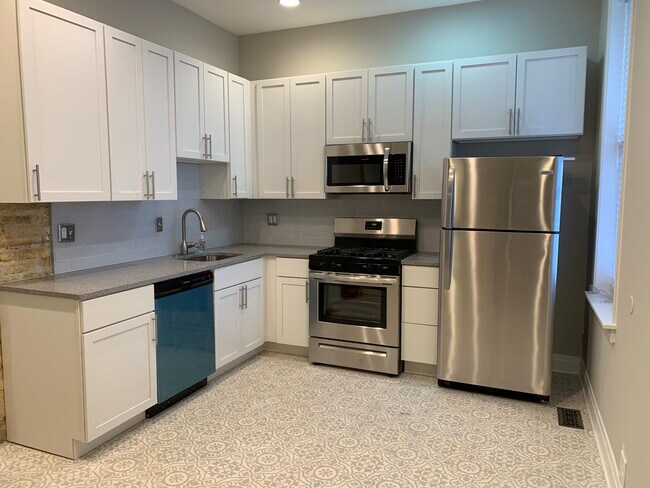 All new kitchen, granite counters, stainless steel appliances, garbage disposal - 1648 N Claremont Ave