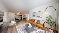Located at 890 S Matlack St in West Chester, PA, this 2-bedroom, 2-bathroom residence offers a thoughtfully designed open-concept floor plan across a single level. The kitchen serves as a central hub, showcasing rich dark-espresso cabinetry, granite countertops, subway tile backsplash, stainless steel appliances, and a large island with a built-in sink — ideal for both cooking and entertaining. The kitchen flows seamlessly into the dining area and spacious living room, all finished with warm wood-look flooring and track lighting overhead. The living room is bathed in natural light from large windows, creating a bright and welcoming atmosphere. The primary bedroom features plush carpeting, a walk-in closet with built-in wire shelving systems, and direct access to a well-appointed en-suite bathroom. The bathroom impresses with dark cabinetry, dual sinks, and generous counter space. A second bedroom and additional full bathroom provide flexibility for guests or a home office. Two dedicated closets offer ample storage throughout. The neutral color palette, crown molding details, and cohesive finishes give the entire residence a clean, modern aesthetic that is both functional and inviting.