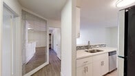 Located at 1538 N Vista St in the heart of West Hollywood, CA, this one-bedroom, one-bathroom unit offers a well-designed single-floor layout with a clean, modern aesthetic throughout. Light wood-style flooring flows seamlessly across all rooms, creating a cohesive and contemporary look.

The combined kitchen and living area forms the central hub of the unit. The galley-style kitchen is thoughtfully appointed with white shaker cabinetry extending to the ceiling, a mosaic tile backsplash, white quartz countertops, a double stainless steel sink, and a full suite of black and stainless steel appliances including a gas range, microwave, and refrigerator. The adjacent living room provides an open, airy feel with access to a door that brings in natural light.

The bedroom offers a comfortable, well-proportioned retreat with a built-in closet and a window that provides natural light. The room's neutral white walls and wood-style flooring maintain the clean, uniform character of the unit. A large decorative mirrored panel in the hallway adds depth and a stylish accent to the transitional space.

The bathroom features a full tub-shower combination with floor-to-ceiling textured tile surround with a built-in niche, a white toilet, and wood-style flooring, delivering a polished and cohesive finish throughout.