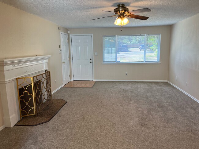 Living room with decorative fireplace - 3801 56th Street Ct E