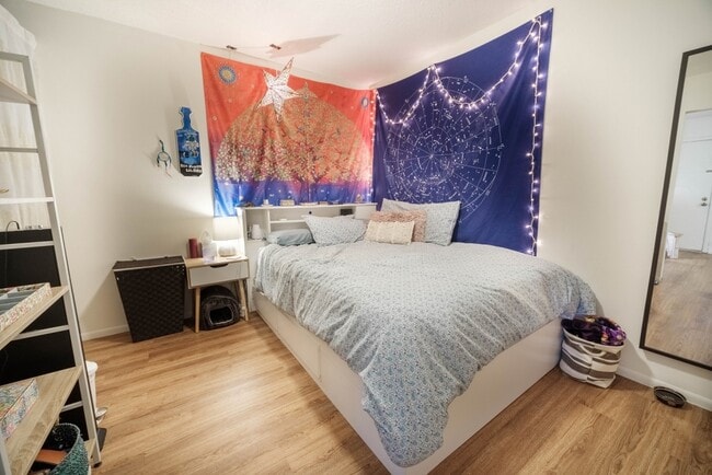 Good sized bedroom with a continuation of hard surface flooring. - Circa Properties