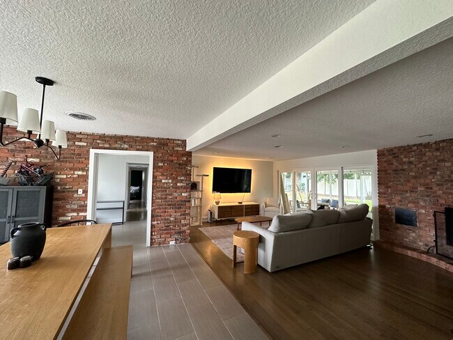 Open concept living area with fireplace - 511 Lake Shore Dr House