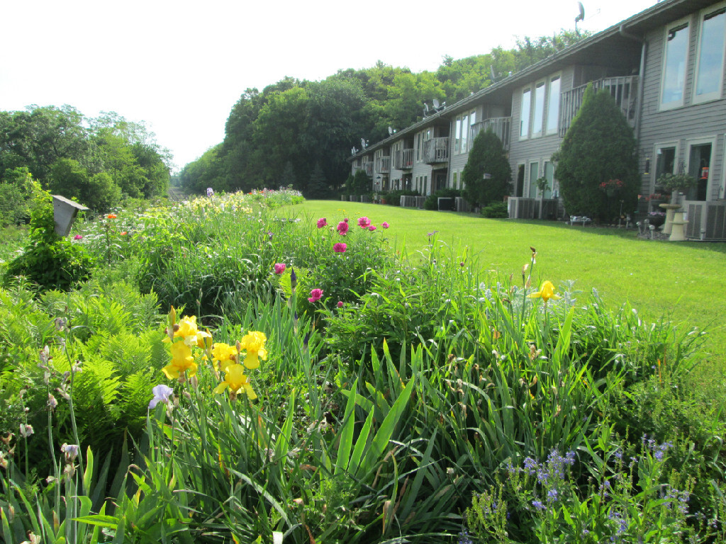 All condos overlook Lake Mallalieu and a beautiful flower garden. - 1201 Saint Croix St