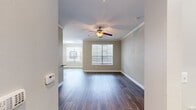 Located at 9404 West Rd in Houston, TX, this well-appointed 2-bedroom, 3-bathroom single-floor residence offers a thoughtfully designed layout with modern finishes throughout. Rich hardwood-style flooring flows seamlessly across all living areas, complemented by neutral toned walls and crisp white trim with crown molding details.

The open-concept kitchen and living area serves as the heart of the home. The kitchen is equipped with stainless steel appliances, including a full-size refrigerator, range, and built-in microwave, all paired with white shaker-style cabinetry and granite countertops. Pendant lighting accents the kitchen island, which opens directly to the living area. The living room is bathed in natural light through large windows with blinds and features a ceiling fan with light fixture.

Both bedrooms are generously proportioned, each offering ceiling fans, natural light, and direct access to closet space. The primary bedroom connects to its own en-suite bathroom. Three well-finished bathrooms include granite vanity countertops, white cabinetry, and a tub-shower combination. A dedicated hallway links the bedrooms to shared spaces, with multiple closets providing ample storage. The in-unit laundry room accommodates a full-size washer and dryer alongside a water heater.