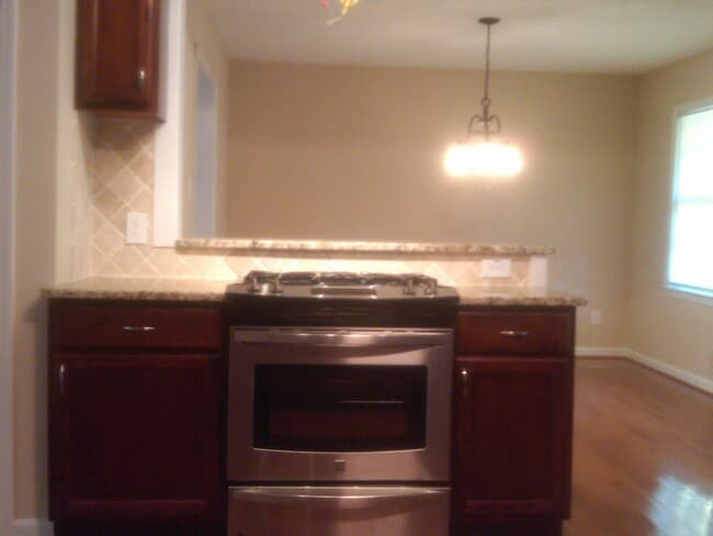Kitchen opens to dining room - 518 Barbashela Cir