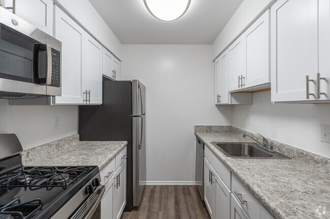 Upgraded White Kitchen - Plaza Apartments