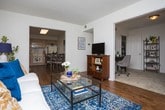 Located in Metairie, Louisiana, this single-floor unit offers a thoughtfully designed layout with comfortable living spaces throughout. The living room serves as a welcoming focal point, featuring warm hardwood-style flooring, natural light from large windows with blinds, and an open feel accented by contemporary artwork and lush greenery. The kitchen is well-equipped with light wood cabinetry, ample counter space, and white appliances including a range, microwave, refrigerator, and dishwasher — ideal for everyday cooking. A dedicated utility area is conveniently integrated with matching cabinetry and includes a full-size washer and dryer. The primary bedroom is generously proportioned with plush carpeting, a ceiling fan, access to a walk-in closet, and a calm, restful ambiance enhanced by curated décor. A second bedroom with carpet flooring accommodates multiple beds and benefits from dual windows dressed with vibrant striped curtains, offering a bright and cheerful atmosphere. Additional bedroom space includes a closet and cozy reading nook. The bathrooms are clean and functional, featuring light wood vanities, a tub-shower combination, and tasteful finishing details. Overall, the space presents a well-maintained, move-in-ready interior with a cohesive, inviting aesthetic throughout.