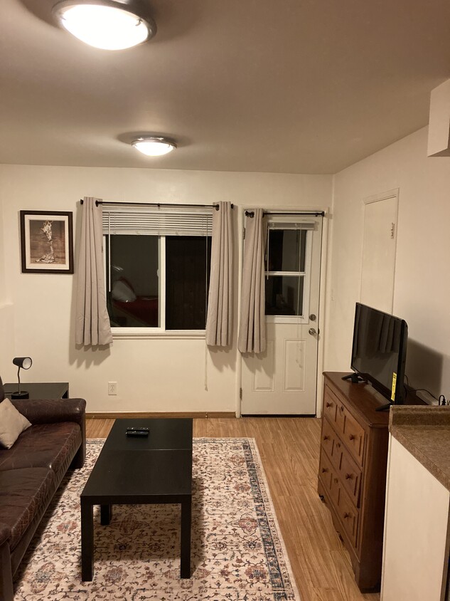 Living area shown with furniture. - 522 Pacific Ave
