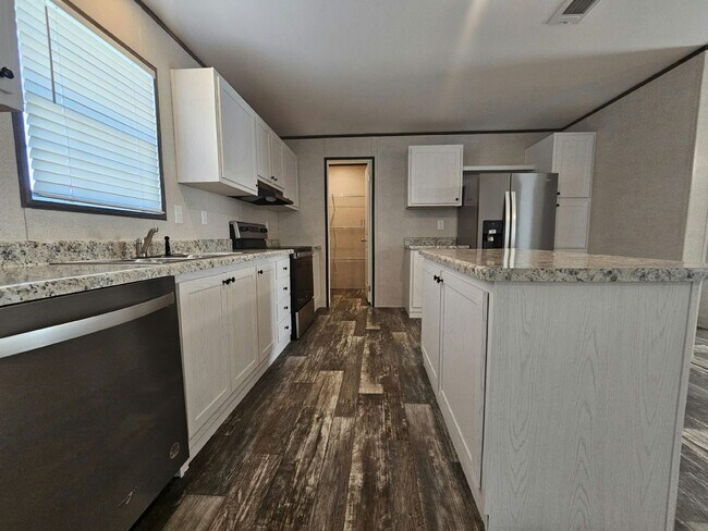 Foto del edificio - 6571 Hidden Oaks Dr