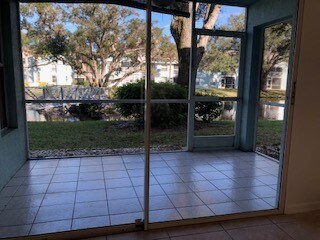 Private lanai viewing lake, fountain and walking bridge. - 181 Grand Oaks Way