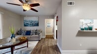 Located at 4010 Linkwood Dr in Houston, TX, this thoughtfully designed 1-bedroom, 1-bathroom residence offers a comfortable and cohesive living experience across a single floor. Rich wood-look flooring flows throughout the main living areas, tying the space together with a warm, contemporary feel.

The living room is bright and welcoming, featuring a ceiling fan and a sliding glass door that opens to an outdoor view, allowing natural light to fill the room. Adjacent to the living area, the dining room offers an intimate setting with its own window and a built-in ledge shelf, ideal for display or storage.

The galley-style kitchen is efficiently designed with dark cabinetry, granite countertops, subway tile backsplash, stainless steel appliances, and a dedicated pantry — maximizing both function and style in a compact footprint.

The spacious primary bedroom features carpeted flooring, a ceiling fan, and a large window with an outdoor view, creating a peaceful retreat. Four closets throughout the unit provide generous storage.

The bathroom is well-finished with dark wood cabinetry, granite countertops, wood-look tile flooring, and a classic subway-tiled tub-shower combination. A hallway connects the rooms efficiently, completing this smartly laid-out Houston residence.