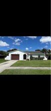 Building Photo - 8110 Rose Marie Ave E
