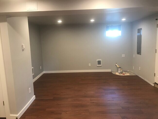 Living area as seen from kitchen-the corner is now a built-in television stand. - 2102 S 8th St