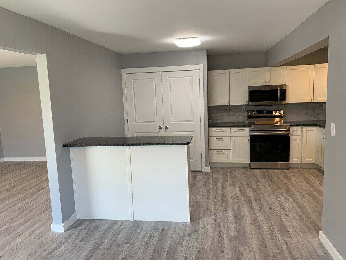 kitchen with island from dining area - 5350 Camelot Dr