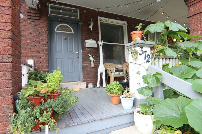Front porch of 372 E Oakland - 372 E Oakland Ave