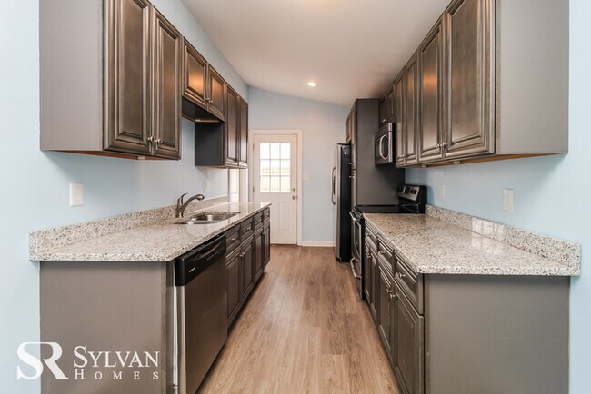 Building Photo - Enjoy easy living in this charming 4BR 2.5...
