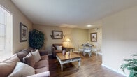 Located at 15 Charleston Park Dr in Houston, TX, this well-appointed one-bedroom, one-bathroom home offers a comfortable and functional single-floor layout. The open living and dining area is a welcoming centerpiece, featuring rich hardwood-style flooring, warm neutral walls, and a textured ceiling. Large windows allow natural light to fill the space, creating a bright and inviting atmosphere. The living area comfortably accommodates both a seating arrangement and a dedicated dining space, making it ideal for everyday living and entertaining.

The galley-style kitchen is efficiently designed with ample white cabinetry, generous counter space, and a full suite of appliances including a refrigerator, stovetop, and dishwasher. The hardwood-style flooring extends into the kitchen, maintaining a cohesive aesthetic throughout the common areas.

The spacious bedroom features plush carpeting, a ceiling fan with light fixture, and a large sliding glass door with vertical blinds that offers outdoor access and abundant natural light. Two closets provide generous storage throughout the home.

The bathroom includes a full tub and shower combination with clean, white finishes. The unit's warm color palette and practical layout make this Houston home a comfortable and inviting retreat.