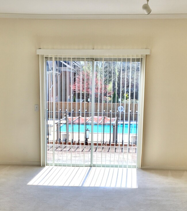 Living Room View to Deck and Pool - 4500 Post Rd