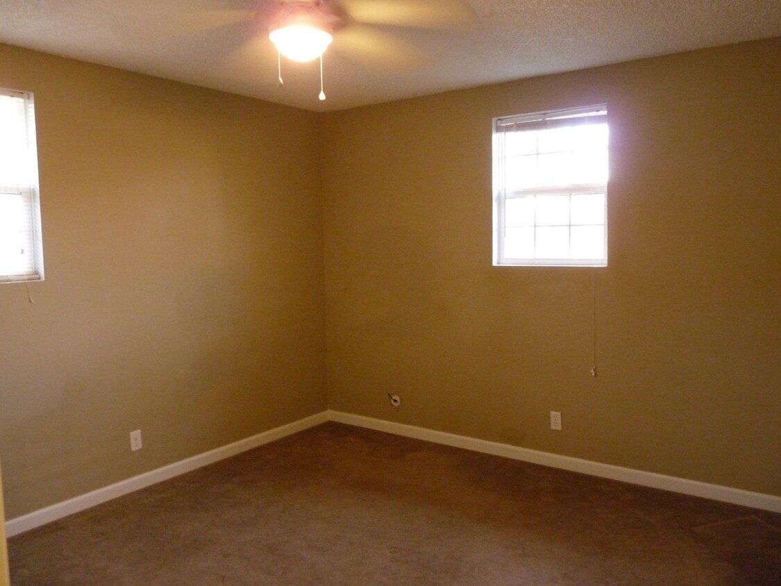 Bedroom one with a ceiling fan - 760 Lynwood Ave