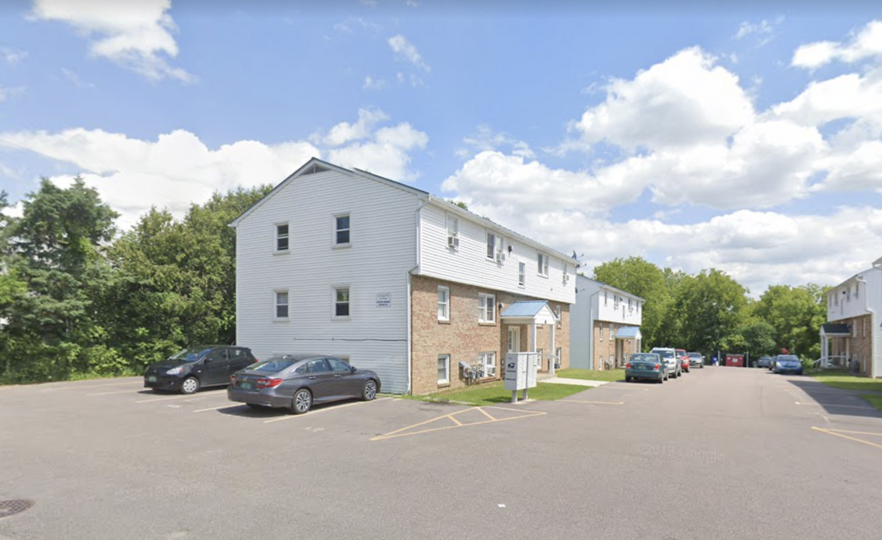 119 Main Street 4A outside, with covered front entrance. Tenants are guaranteed one parking spot next to unit, and spot(s) in the rear of association lot. - 119 Main St