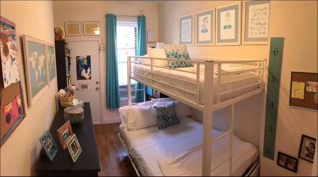 Bedroom with backyard access - 312 Weirfield St