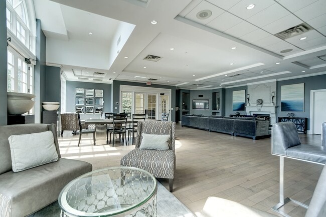 Expansive Resident Clubhouse with Plush Seating Areas, Cozy Fireplace, Balcony Area, and Bar - The Park At Arlington Ridge
