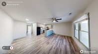 Located at 616 E Knox St in Durham, NC, this one-bedroom, one-bathroom unit offers a practical and well-designed single-floor layout. The open-concept living, dining, and kitchen area forms the heart of the home, finished with durable wood-look vinyl plank flooring and neutral-toned walls throughout. A ceiling fan keeps the living space comfortable, while a window and entry door provide natural light and direct access to the outdoors.

The kitchen is a functional highlight, featuring a peninsula with granite-style speckled countertops, gray-toned cabinetry, a black refrigerator, an electric range, and a sink with a modern faucet — all designed for efficient use of space.

The bedroom is a generously sized retreat equipped with a ceiling fan, two closets, and a sliding glass door that opens to a private balcony overlooking a lush, wooded backdrop. The balcony provides a peaceful outdoor escape with natural scenery.

The full bathroom includes a shower/tub combination, a vanity with a white countertop, and matching wood-look flooring that ties the space together. A dedicated laundry area adds everyday convenience. The consistent use of soft sage accents on trim, doors, and baseboards gives the unit a cohesive, refreshed aesthetic throughout.