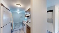 Located at 1904 E South Riverton Ave in Spokane, WA, this two-bedroom, one-bathroom residence offers a practical and comfortable single-floor layout. The open-concept kitchen and living area feature warm hardwood-style flooring, a functional kitchen with wood-toned cabinetry, a built-in stovetop, and ample counter space — ideal for everyday cooking and entertaining. A hallway connects the main living areas to the private bedrooms and bathroom.

Both bedrooms are carpeted and finished with neutral gray walls, providing a calm and restful atmosphere. Each room is equipped with a ceiling fan with integrated lighting, a baseboard heater for year-round comfort, and a window with blinds that allows natural light while maintaining privacy. The primary bedroom offers a generous footprint and includes a sliding-door closet for convenient storage. The second bedroom is similarly well-proportioned and versatile in use.

The full bathroom is clean and functional, featuring a combined tub and shower unit with a curved curtain rod, hardwood-style flooring, and neutral gray walls that create a cohesive look throughout the home. The overall design is straightforward and move-in ready, with consistent finishes and practical amenities throughout.