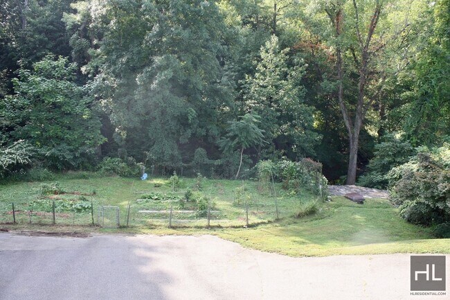 Building Photo - 3.5BR 1.5BA Triplex w/ Elevated Wood Deck, Vegetable Garden, Private Parking, Waterfall & Finishe...