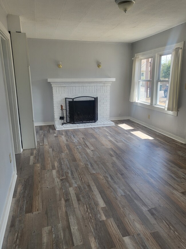 living room with wood burning fireplace - 451 16th St SE