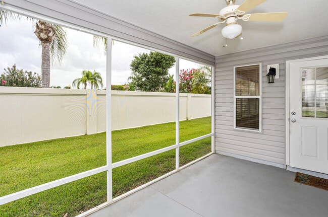 Screened-in lanai in back - 1631 Blossom Ter