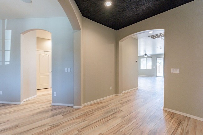 Building Photo - Four Bedrooms, 3 Car Garage - New flooring!