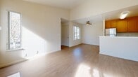 Located at 400 W Central Ave in Tracy, CA, this well-appointed 2-bedroom, 3-bathroom residence offers a thoughtfully designed single-floor layout. The open-concept living and kitchen area serves as the heart of the home, featuring vaulted ceilings that lend a sense of spaciousness, light wood-tone plank flooring, and a ceiling fan. A striking fireplace with a classic white surround anchors the living space, which is bathed in natural light through a sliding glass door leading to an outdoor balcony. The kitchen is equipped with stainless steel appliances — including a gas range, refrigerator, and dishwasher — complemented by warm wood cabinetry, a peninsula with a sink, and tile-style flooring. A dedicated entrance area adds a welcoming transition into the main living spaces. Both bedrooms are carpeted and generously sized, with the primary bedroom featuring a large window overlooking the surrounding neighborhood. Each bedroom benefits from closet storage, with six closets distributed throughout the unit for ample organization. The three bathrooms are clean and functional, each featuring a tub/shower combination, wood-toned vanity cabinetry, and light flooring. A utility room and hallway complete the efficient floor plan, making this a practical and comfortable home.